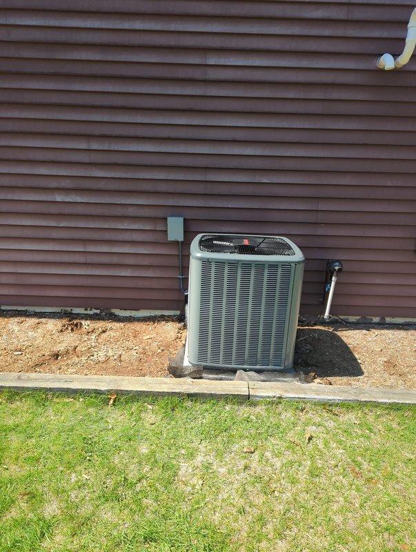 Completed full residential air conditioning system replacement with new outdoor condensing unit manufactured by Comfort Technologies Manufacturing, Inc. Unit was installed on existing concrete pad with proper electrical disconnect, refrigerant line connections via brass service valves with protective caps, and conduit routing along exterior siding. System was charged with 6.5 pounds of refrigerant per manufacturer specifications, tested for proper operation, and documentation photographed for service records.