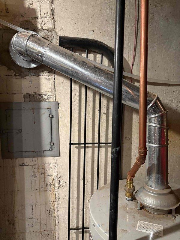 Responded to service call for 13-year-old water heater that failed to reignite. Upon inspection, documented existing installation including copper supply lines, pressure relief valve, and venting system. Unit was assessed and determined to be at end of serviceable life, unable to maintain reliable ignition. Provided documentation and recommendations for replacement options.