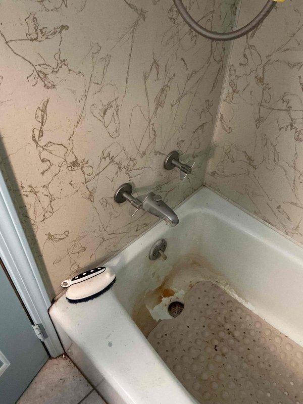 Responded to service call for two leaking faucets in a 90-year-old residential property—one in the kitchen and one at the bathroom tub, both actively leaking for 1–2 weeks. Performed installation of customer-supplied replacement kitchen faucet, ensuring proper mounting, connection to existing supply lines, and verification of leak-free operation. Inspected bathroom tub faucet assembly and addressed the leak at the valve or spout connection. Tested both fixtures under normal operating pressure to confirm repairs eliminated all water leakage. Documented existing conditions including aged plumbing infrastructure and visible water damage patterns consistent with the reported leak duration.