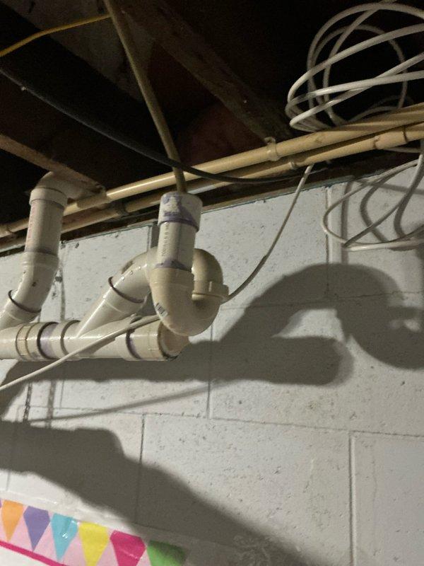 Conducted comprehensive evaluation of existing 16-year-old HVAC system including furnace and air conditioning unit to assess replacement needs and provide equipment recommendations. Inspected current system installation, ductwork configuration, venting arrangement with PVC piping, and supporting mechanical components in basement utility area to determine proper sizing and compatibility requirements for new equipment installation.