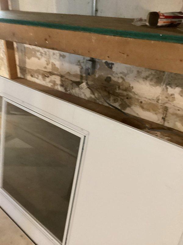 Conducted site assessment for electrical dryer hookup installation in basement utility area. Documented existing laundry area conditions, including current plumbing connections, ventilation ductwork, and available electrical infrastructure. Identified water damage and mold growth on adjacent walls requiring remediation before electrical work can proceed safely, and photographed utility room layout to prepare comprehensive project estimate for complete dryer installation.