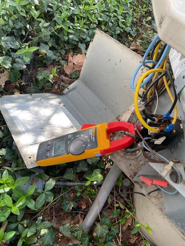 Responded to no cooling complaint on 10-year-old Bryant air conditioning system. Upon arrival, confirmed unit was running but delivering warm air to conditioned space. Performed diagnostic evaluation of outdoor condensing unit using clamp meter to measure electrical amperage and verify compressor operation. Connected refrigerant manifold gauges with standard blue and yellow hoses to service ports to assess system pressures and refrigerant charge levels. Testing revealed abnormal operating pressures consistent with refrigerant loss. Identified system deficiency and completed necessary repairs to restore proper cooling function. Unit tested and verified operational upon completion of service work.