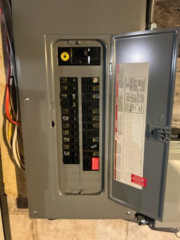 Conducted comprehensive assessment of existing HVAC system for air conditioning estimate. Documented current Goodman furnace installation in basement utility area, including extensive ductwork configuration and electrical service panel with main breaker and circuit distribution. Evaluated equipment condition, spatial constraints, and electrical capacity to determine requirements for proposed AC system integration with existing forced-air heating infrastructure.