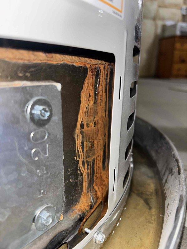 Responded to water heater leak complaint and performed inspection of 6-year-old residential unit. Upon arrival, confirmed water heater was leaking into drain pan, indicating potential tank failure or connection issue. Documented existing condition with photos showing unit placement in basement utility area and evidence of moisture accumulation. Assessed water heater for age-related deterioration and verified leak source at tank body, consistent with internal tank corrosion typical of units in this age range. Customer contacted for authorization to proceed with replacement recommendations.