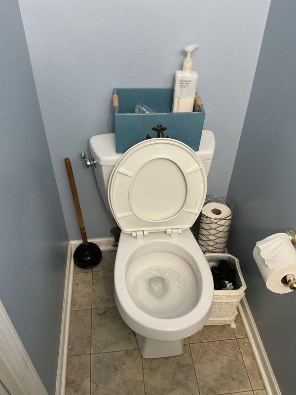 Responded to emergency call for backed-up first floor toilet. Upon arrival, found standard white porcelain toilet experiencing drainage blockage that posed overflow risk. Successfully cleared obstruction using appropriate plumbing tools, restoring full functionality to the unit. Verified proper flushing operation and confirmed drainage system was flowing freely with no remaining backup issues.