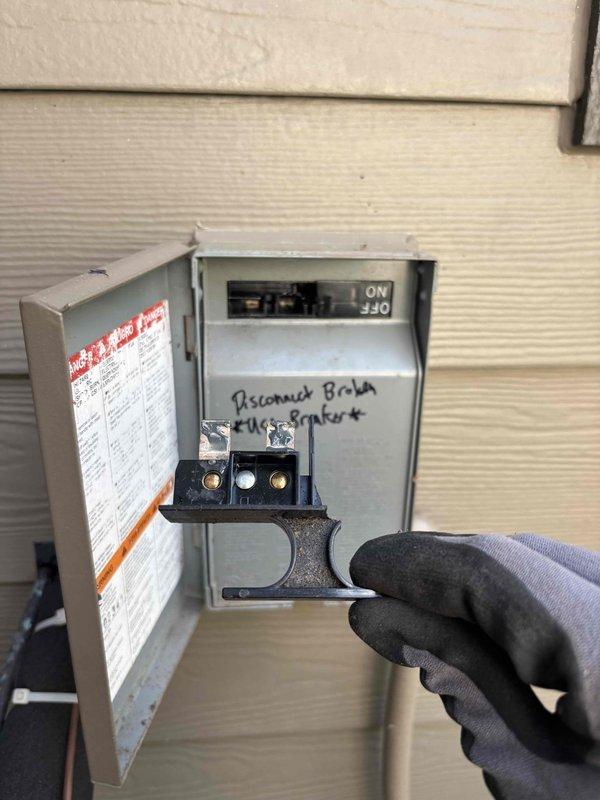 Responded to no-cool condition on residential air conditioning system. Upon inspection, discovered failed disconnect switch and blown fuse at exterior disconnect box, preventing power to condensing unit. Documented equipment condition with client present per their specific request for diagnostic-only service with no recommendations.