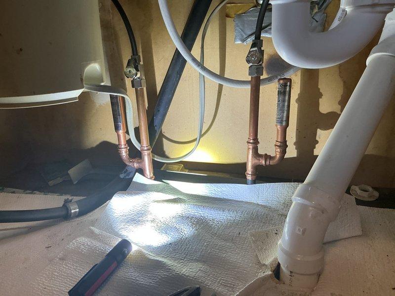 Responded to service call for kitchen sink with no water flow. Upon inspection, identified obstruction in supply line affecting water delivery to faucet. Disassembled plumbing connections under sink, cleared blockage from water supply system, verified proper flow through both hot and cold lines, reassembled all fittings, and tested fixture to confirm full restoration of water pressure and normal operation.