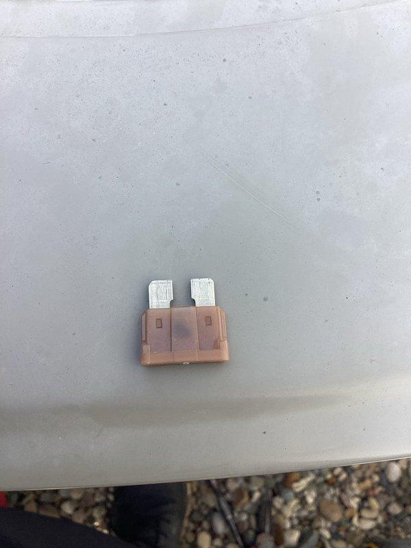 Responded to no-cooling call on 10-year-old American Standard unit that was completely inoperative. Upon arrival, performed diagnostic inspection of outdoor condensing unit electrical system. Located failed blade-type fuse in control circuit preventing unit operation. Removed defective fuse, verified proper amperage rating, and installed replacement fuse. Tested all electrical connections at contactor and capacitor terminals for proper voltage and secure connections. Cycled system through complete operational test to confirm unit startup and normal cooling function restored. Unit operating within manufacturer specifications at time of departure.