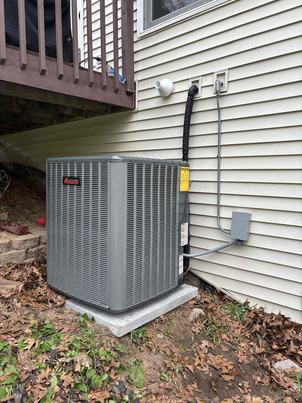 Completed full system replacement including installation of new high-efficiency furnace in basement utility area and matching outdoor condensing unit. Furnace installed on protective mat with proper venting via white PVC piping and connected to existing ductwork system. Outdoor unit positioned on concrete pad against exterior wall with electrical disconnect box mounted, refrigerant lines run through black flexible conduit, and all connections properly secured. All required documentation processed through Michigan Saves financing program and loan paperwork submitted electronically for approval.