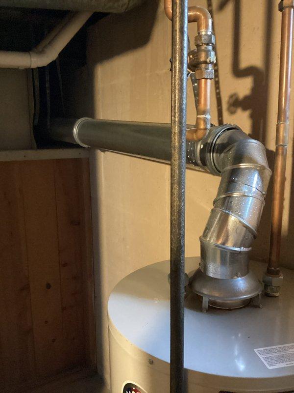 Responded to no hot water complaint on approximately 13-year-old residential water heater. Upon inspection, determined unit had reached end of serviceable life and was no longer producing hot water. Documented existing installation including copper supply lines, expansion tank, and venting configuration for customer records.