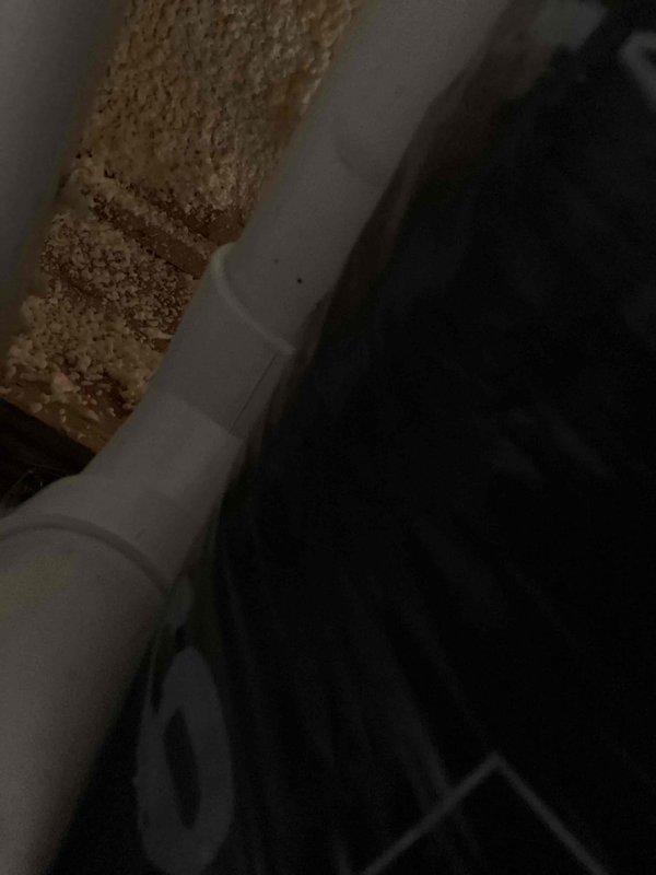 Responded to no-cooling complaint on 10-year-old Payne air conditioning system. Upon arrival, performed system diagnostic and inspection of attic-mounted equipment. Accessed unit through confined attic space with existing insulation materials including foam board and radiant barrier products. Inspected refrigerant lines, condensate drainage system, and ductwork connections. Documented equipment condition and surrounding installation environment with photographic evidence showing PVC condensate line routing and insulation configuration. System evaluation completed to determine root cause of cooling failure.