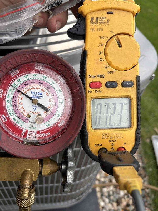 Responded to a return service call for a 4-year-old Carrier condo unit experiencing insufficient cooling capacity. Previously serviced the system one year ago for low refrigerant charge, at which time UV dye was added to the system for leak detection. Upon arrival, confirmed unit was operating but unable to reach setpoint temperature. Connected manifold gauges and digital testing equipment to service ports on outdoor unit to verify refrigerant pressures and system performance. Found refrigerant charge low again, indicating a leak in the system that requires further diagnosis and repair.