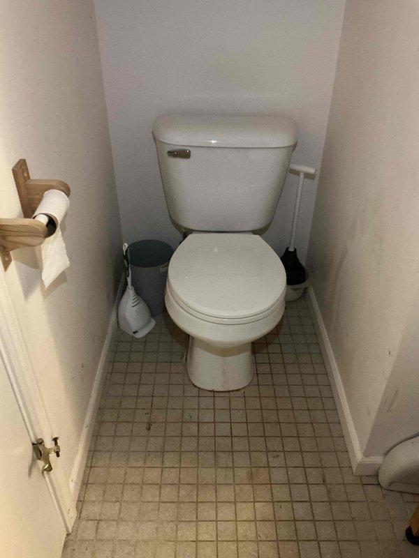 Responded to recurring drain blockage in residential bathroom that had previously been cleared. Upon arrival, set up wet/dry vacuum equipment to address the stoppage. Performed drain cleaning procedures on toilet drain line using mechanical methods. Blockage was successfully cleared and drainage restored to normal flow. Verified proper operation of fixture after completion. Equipment was staged in bathroom work area during service. Issue appears to be related to recurring buildup in the line requiring periodic maintenance intervention.