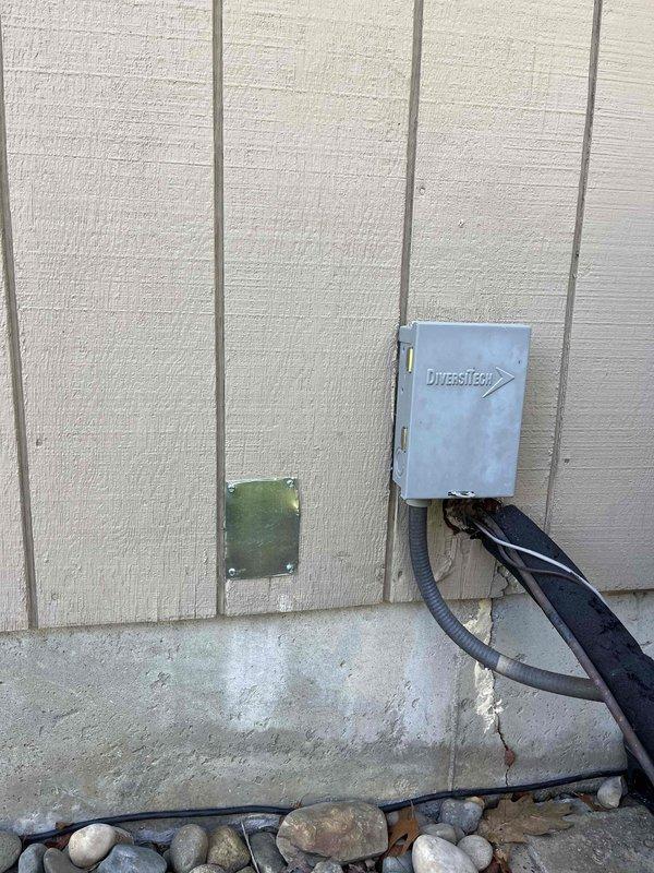 Completed annual cooling maintenance on 12-year-old EnergiAir system with 2020 condenser model. Performed comprehensive tune-up including electrical testing of dual-run capacitor (CRB65B, 45/5 MFD, 370V) using multimeter to verify proper microfarad readings and ensure reliable compressor and condenser fan motor operation. Inspected exterior condensing unit mounted on building with proper clearances, verified all electrical connections secure, and documented equipment condition through diagnostic photography.