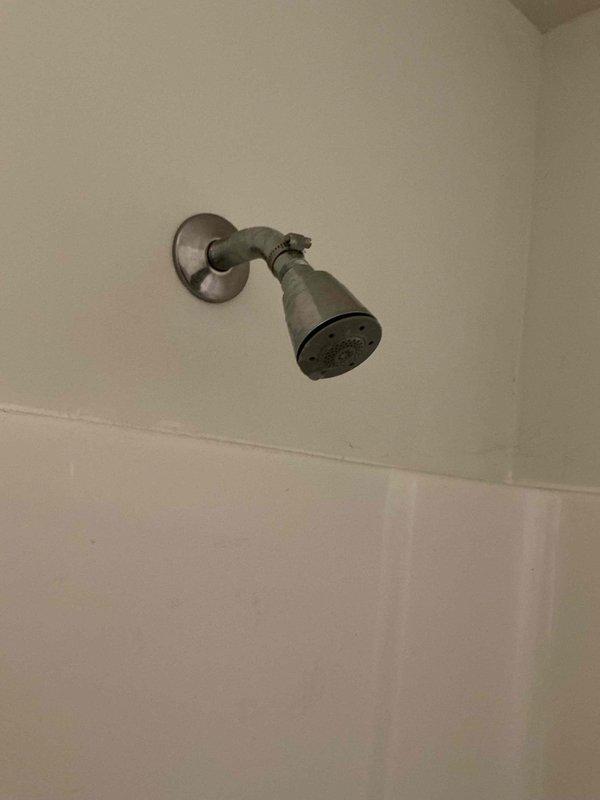 Responded to service call for two leaking shower faucets and outdoor spigot evaluation. Repaired Delta shower valve assemblies experiencing handle leaks in bathroom shower system. Assessed outdoor hose bib and provided repair recommendations versus replacement options. Trip charge waived for customer satisfaction purposes.