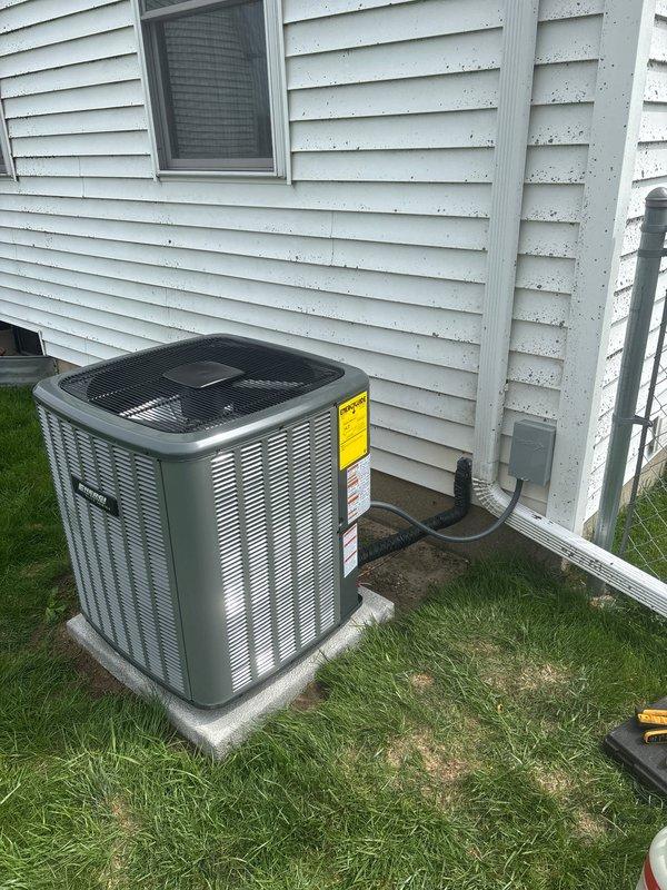 Completed full installation of new air conditioning condenser unit on exterior concrete pad with proper clearances from building structure. Unit secured to pad, refrigerant lines connected and properly insulated, electrical disconnect installed on building exterior, and all penetrations through siding sealed. System charged to manufacturer specifications per unit label, startup performed, and operational testing confirmed proper function of all components.