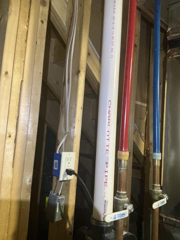 Responded to service call for Bradford White Defender Safety System water heater not reaching temperature setpoint. Performed diagnostic inspection of approximately 6-year-old unit installed in basement utility area. Verified gas supply valve operation, inspected all copper piping connections and shut-off valves at top of unit for proper configuration. Examined thermocouple and pilot assembly through access panel. Checked temperature pressure relief valve and all visible plumbing connections including PEX hot and cold water supply lines for leaks or restrictions. Documented unit condition with photographs showing proper venting, gas line connections, and overall installation setup. Unit specifications and safety labels verified to be intact and legible.