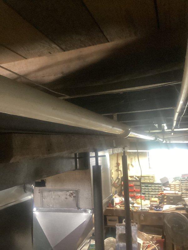 Responded to recurring kitchen drain issue that required service every 3-4 years. Upon arrival, investigated customer concern that the blockage was located in the basement drain line rather than the kitchen drain itself, as a previous technician had only cleaned the trap without snaking the line. Accessed basement plumbing system, located the affected drain line below the kitchen, and performed cable snaking procedure to clear the blockage in the basement section of the drainage system, resolving the issue at its source.