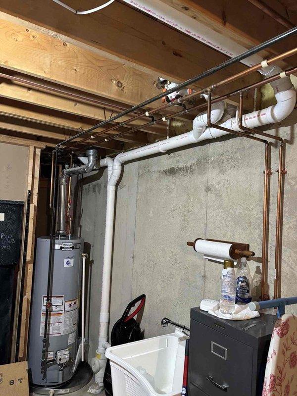 Responded to customer concern regarding mold growth on basement concrete walls that was attributed to previous service work. Upon inspection, applied bleach solution to affected concrete foundation surfaces and thoroughly cleaned all areas showing discoloration and potential mold development. Documented pre-existing conditions and completed remediation work in unfinished basement utility area containing water heater and plumbing infrastructure.