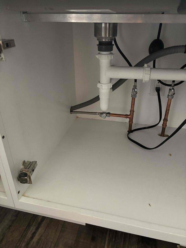 Removed existing dishwasher from under-counter installation and successfully installed customer-supplied stainless steel replacement unit. Connected dishwasher drain line to existing garbage disposal knockout and verified proper water supply connections to ensure leak-free operation and code compliance.