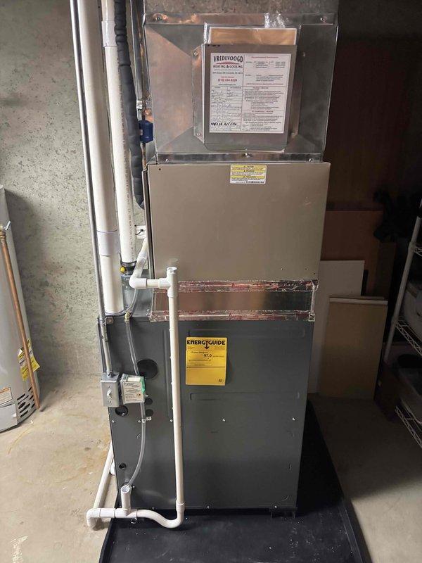 Completed no-charge estimate for installation of ARVT96060 air filtration system. Assessed existing HVAC equipment in basement mechanical room, including current furnace and air handler configuration. Documented installation location and verified compatibility with existing ductwork system. Photographed current setup showing furnace unit, PVC venting, and available mounting space for proposed air quality equipment.