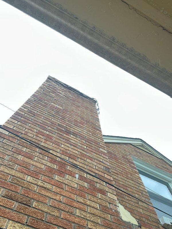 Responded to no heat call on 16-year-old furnace. Diagnosed failed exhaust inducer motor assembly preventing unit operation. Removed defective blower motor from chimney venting system and replaced with new component. Verified proper draft, tested system operation, and confirmed furnace restored to normal heating function.