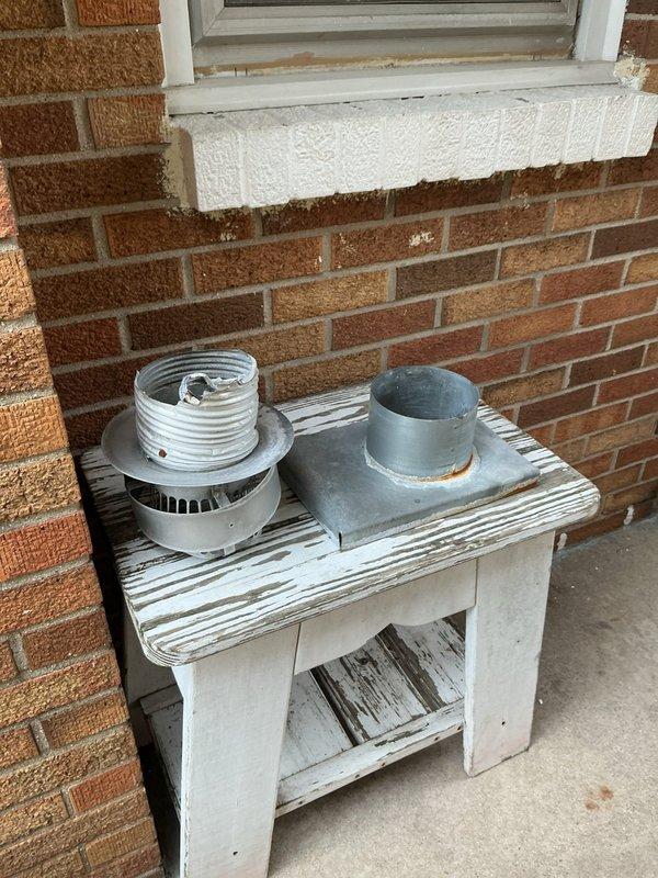 Responded to no heat call on 16-year-old furnace. Diagnosed failed exhaust inducer motor assembly preventing unit operation. Removed defective blower motor from chimney venting system and replaced with new component. Verified proper draft, tested system operation, and confirmed furnace restored to normal heating function.