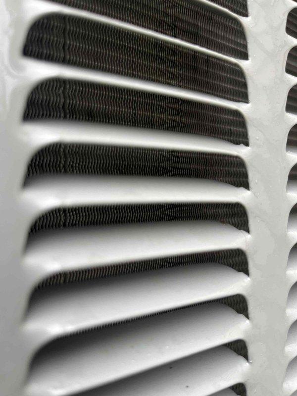 Completed annual cooling maintenance and tune-up on residential HVAC system under 3-year EnergiAir maintenance agreement. Inspected ventilation registers and found significant dust and debris accumulation in supply grilles; documented condition with photos. Examined evaporator coil assembly and heat exchanger fins, which showed clean, well-maintained condition with proper spacing and no obstructions. Performed standard seasonal maintenance procedures including system performance verification and operational testing to ensure efficient cooling operation for the upcoming season.