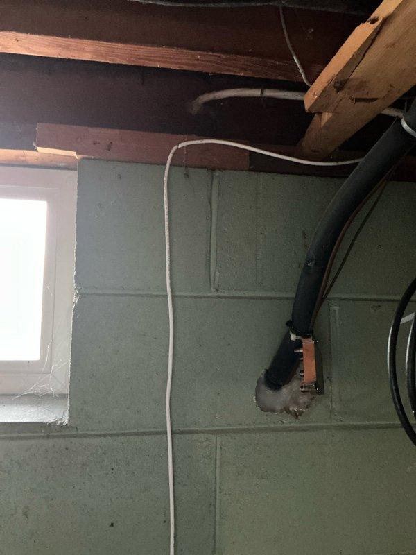 Completed annual AC tune-up and maintenance on a 30-year-old Lennox system located in basement utility area. Performed comprehensive inspection of furnace unit, verified proper operation of all components, checked venting system with white PVC intake and exhaust pipes, and documented equipment condition with photos showing furnace, ductwork, and surrounding mechanical systems in satisfactory working order.