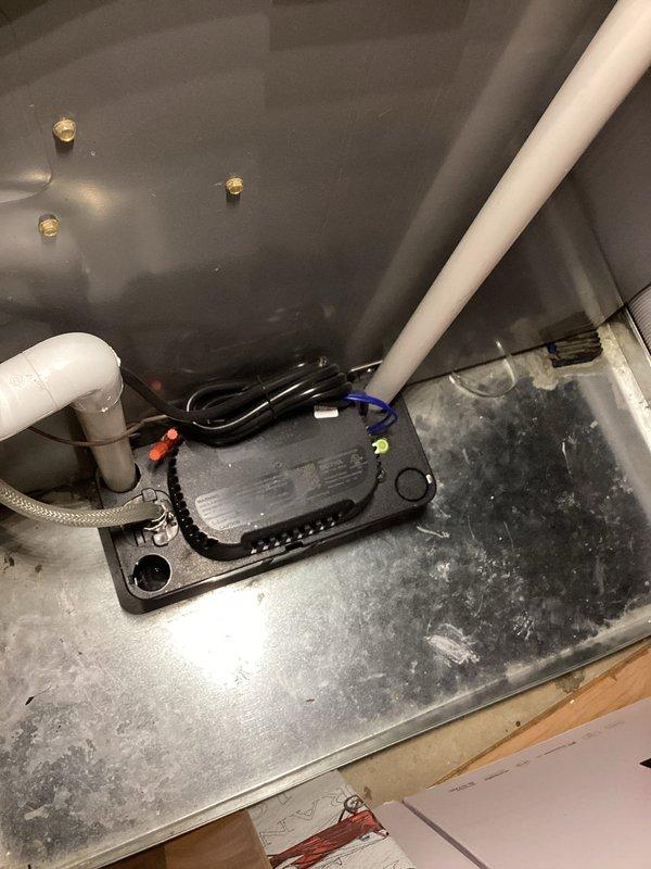 Completed annual cooling maintenance on EnergiAir system (WT 07-2035). Performed comprehensive inspection of air handler components including control board, electrical connections, and condensate drainage system. Verified proper operation of all mechanical and electrical components, documented system condition with photos showing interior cabinet components, wiring connections, and PVC condensate piping with visible wear patterns on unit base indicating normal operational use.