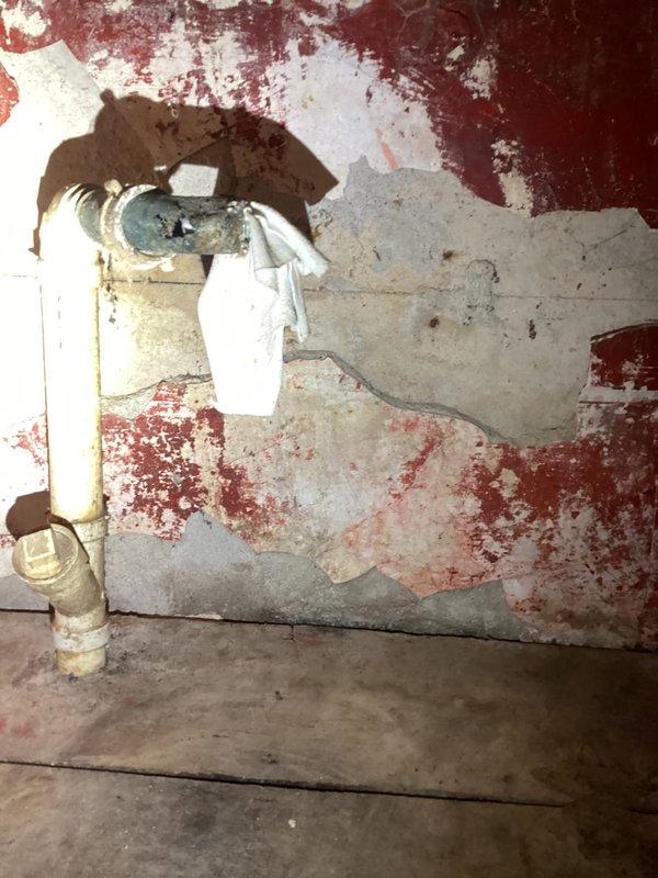 Conducted comprehensive plumbing assessment for kitchen faucet and under-sink pipe replacement project. Property inspection revealed extensive basement water damage, deteriorated walls with significant moisture infiltration, and aging plumbing infrastructure requiring immediate attention beyond the original scope. Documentation included photographic evidence of compromised wall surfaces, standing water on basement floor, corroded pipe assemblies, and structural concerns related to ongoing moisture issues. Provided detailed project estimate addressing both requested kitchen plumbing work and critical basement waterproofing recommendations to prevent further property deterioration.