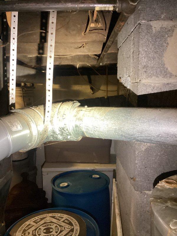 Responded to no hot water call for 5-year-old Richmond water heater. Upon inspection, discovered severe corrosion and rust at copper pipe connections on top of unit, indicating failed tank integrity with water leakage at inlet/outlet ports. Documented extensive deterioration around pipe penetrations with photographic evidence showing orange-brown discoloration consistent with ongoing water seepage. Unit deemed non-repairable due to tank failure and recommended immediate replacement to restore domestic hot water service.