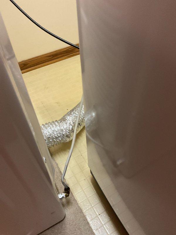 Responded to gas leak emergency at residential dryer installation. Upon arrival, confirmed utility company had identified leak source at appliance connection point. Inspection revealed kinked copper gas line causing active leak at approximately one-month-old dryer unit. Gas supply to dryer had been shut off prior to arrival for safety. Assessed damaged copper line and determined replacement with proper flexible gas connector was required. Installed new flex hose connection to manufacturer specifications, ensuring proper routing to prevent future kinking or strain on gas line. Performed leak test using approved detection solution at all connection points. Restored gas supply and verified system integrity with no leaks detected. Dryer returned to safe operational status.