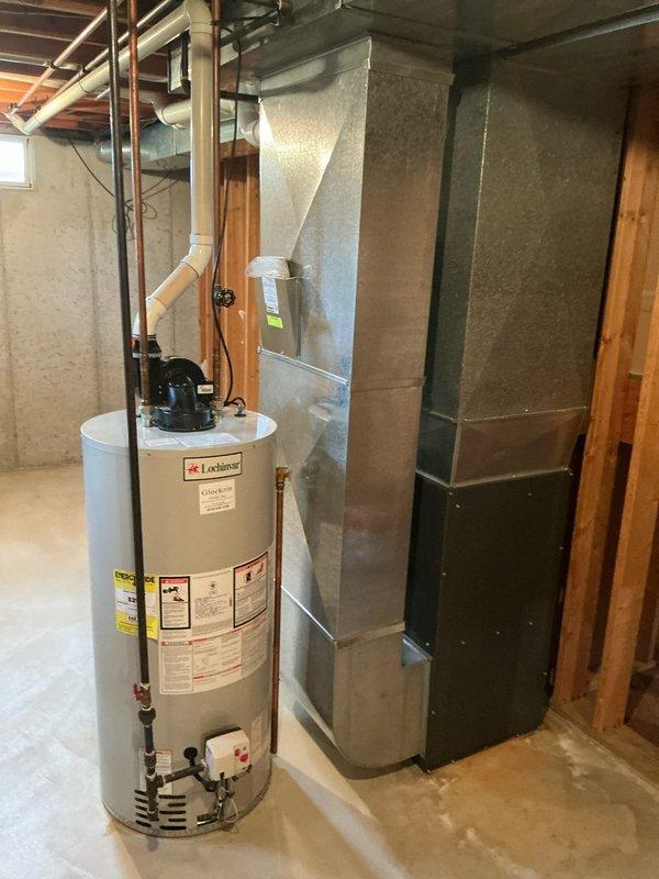 Inspected 30-year-old residential air conditioning system and discovered severely corroded evaporator pan actively leaking condensation onto the furnace platform. Documented that the existing AC unit from 1996 operates on obsolete R12 refrigerant, which is no longer serviceable or environmentally compliant. Evaluated the 2011 Goodman furnace and confirmed it remains in serviceable condition and does not require replacement at this time. Photographed the mechanical room showing the HVAC equipment, water heater, ductwork configuration, and installation environment. Prepared comprehensive replacement estimate for new air conditioning system while preserving the existing furnace unit.