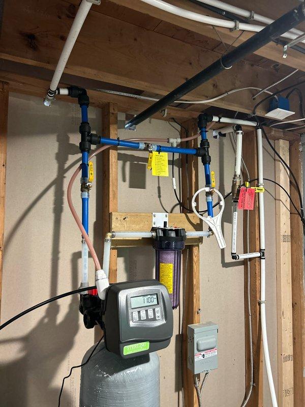 Returned to property to restore water service and complete reverse osmosis system installation. Installed 3/8 x 1/2 push connect adapter for discharge line and 1/4 female thread to 1/4 push connect fitting for RO line, completing the water filtration system integration with existing water softener. Coordinated remote access with property management to gain entry, tested system operation, and verified proper water flow through all treatment stages.