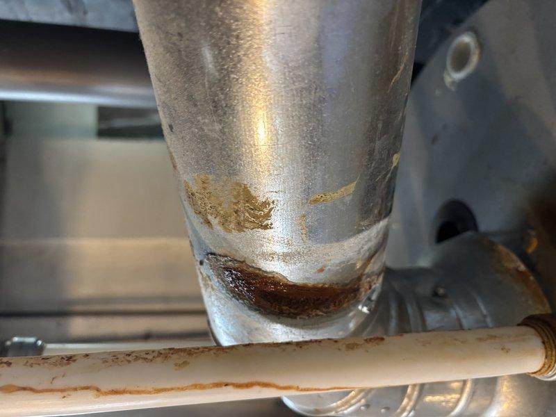 # Furnace Super Tune-Up Completed

Performed comprehensive tune-up service on furnace system over 10 years old. Conducted full system inspection, cleaned and tested all components, verified proper operation of safety controls, and checked combustion efficiency. During inspection, documented significant corrosion and rust deterioration on gas piping connections and elbows, particularly around threaded joints where moisture exposure has caused metal degradation. Noted galvanized piping showing advanced surface corrosion with flaking material present. System operational at time of service completion, though corroded gas piping will require future attention and replacement to prevent potential safety concerns.