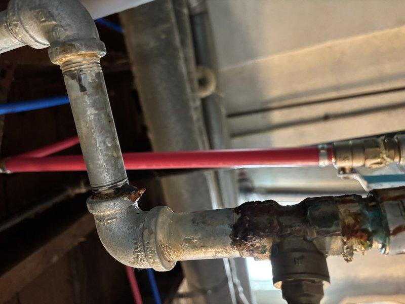 # Furnace Super Tune-Up Completed

Performed comprehensive tune-up service on furnace system over 10 years old. Conducted full system inspection, cleaned and tested all components, verified proper operation of safety controls, and checked combustion efficiency. During inspection, documented significant corrosion and rust deterioration on gas piping connections and elbows, particularly around threaded joints where moisture exposure has caused metal degradation. Noted galvanized piping showing advanced surface corrosion with flaking material present. System operational at time of service completion, though corroded gas piping will require future attention and replacement to prevent potential safety concerns.