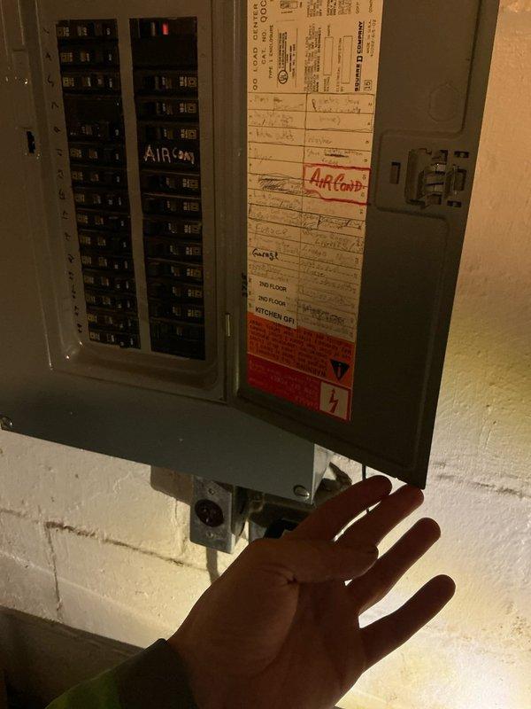Conducted on-site assessment for ductless mini-split system installation at residential property with existing 15-year-old Comfort Maker equipment. Evaluated bedroom space and electrical infrastructure to determine appropriate zone configuration, documenting room layout and available electrical panel capacity for new system requirements.