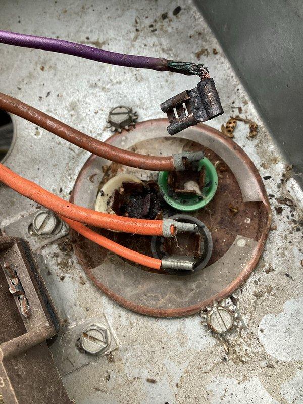 Completed annual cooling maintenance on 23-year-old Rheem system. Performed comprehensive tune-up including inspection of electrical connections, which showed significant age-related corrosion and oxidation on terminal blocks and wire connections. Documented deteriorated conditions with photos for customer records, noting moisture exposure and environmental wear on junction components requiring future attention.