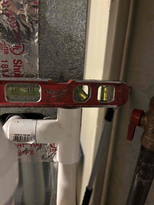 Completed annual cooling maintenance on 8-year-old Goodman system. Verified proper level and alignment of condensate drain lines using precision measuring tools, inspected PVC drainage components for proper installation and flow, and confirmed all piping connections are secure and functioning correctly to prevent water damage or drainage issues.