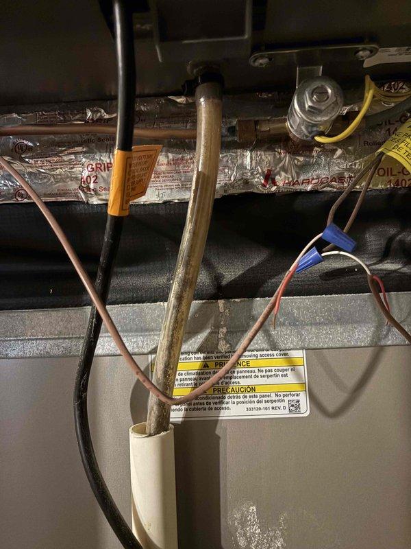 Completed annual cooling maintenance on 7-year-old Carrier system. Inspected air handler and evaporator coil, noting significant dust and debris accumulation on coil surface with heavy contamination restricting airflow. Documented condition of ductwork, refrigerant lines, and electrical connections. All copper refrigerant lines showed normal patina with no visible leaks. Verified proper operation of system components and safety controls. Captured documentation of equipment condition for service records.