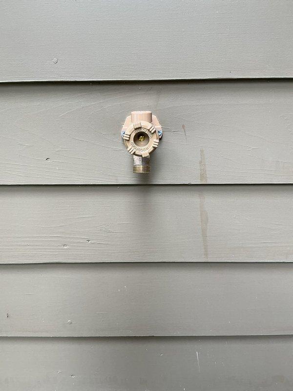 Responded to plumbing leak service call that had been actively leaking for two days but was no longer flowing at time of arrival. Conducted thorough inspection of property to identify source of previous leak and assess condition of water fixtures. Inspected exterior hose bibs including frost-free spigot mounted on building exterior and ground-level irrigation valve assembly. Both fixtures showed signs of age and weathering consistent with outdoor exposure. Evaluated three water faucets throughout the property as indicated by homeowner for potential replacement needs. Documented current condition of all fixtures with photographs for service records. Confirmed no active water flow present and verified no visible property damage resulting from the leak incident. Provided assessment and recommendations for fixture replacements to prevent future leak occurrences.