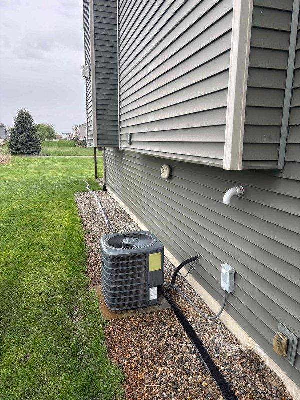 Conducted site assessment and provided project estimate for potential sump pump replacement in eleven-year-old residential property. Inspected existing submersible sump pump system with PVC discharge piping in basement area, noting water staining on concrete floor and functional pump assembly within basin. Documented current system condition and exterior discharge configuration for quote preparation, with no immediate operational issues identified at time of inspection.