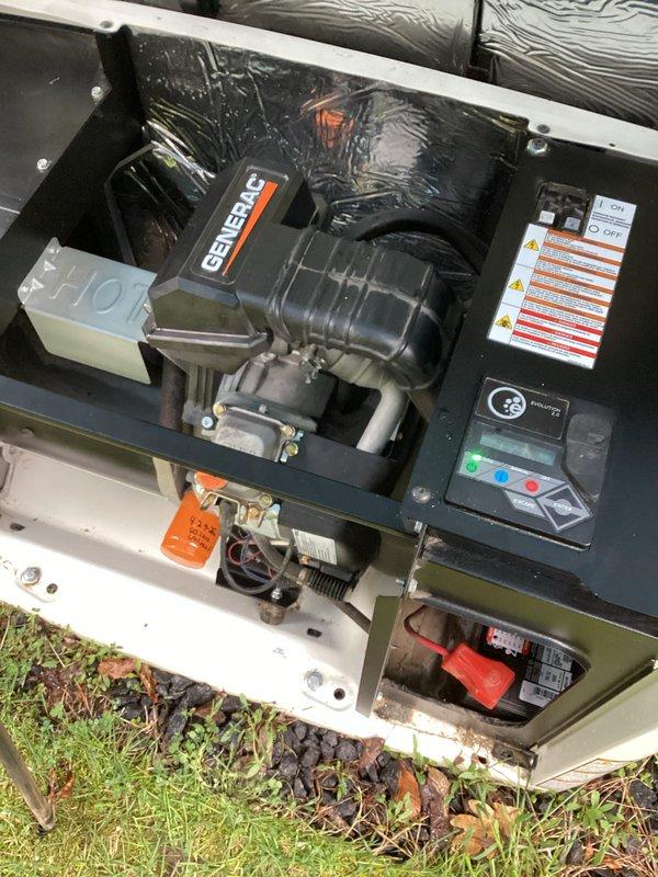 Completed 7-year tune-up service on Generac standby generator unit. Performed comprehensive inspection of engine compartment, control panel, and electrical connections. Observed significant frost accumulation on internal coils indicating potential airflow restriction or refrigerant issue requiring monitoring. Verified battery terminal connections secure, control panel operational with display functioning properly, and all safety labels intact. Unit accessible and operational at time of service completion.