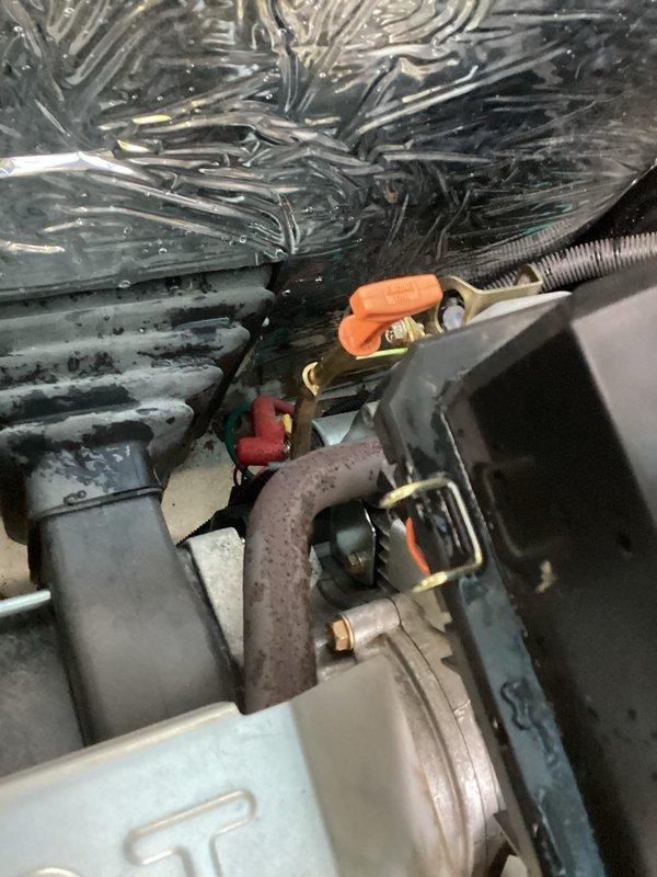 Completed 7-year tune-up service on Generac standby generator unit. Performed comprehensive inspection of engine compartment, control panel, and electrical connections. Observed significant frost accumulation on internal coils indicating potential airflow restriction or refrigerant issue requiring monitoring. Verified battery terminal connections secure, control panel operational with display functioning properly, and all safety labels intact. Unit accessible and operational at time of service completion.