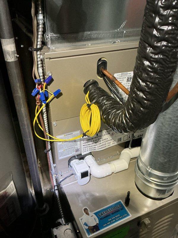 Installed evaporator freeze thermostat and low ambient kit on HVAC system. Completed electrical connections with proper wire management and verified all components functioning correctly. System tested and operational with new controls in place to prevent freeze-up conditions during low ambient temperature operation.