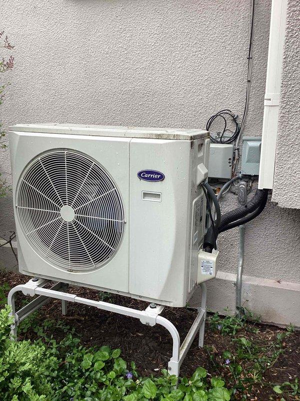 Responded to service call for Carrier system displaying 01 error code following recent circuit breaker installation. Inspected outdoor condenser unit and electrical connections at both exterior disconnect and interior panel. Diagnosed error code related to electrical configuration issue stemming from new breaker work. Corrected wiring connections, verified proper voltage supply to unit, and cleared fault code. System tested successfully with normal operation restored.
