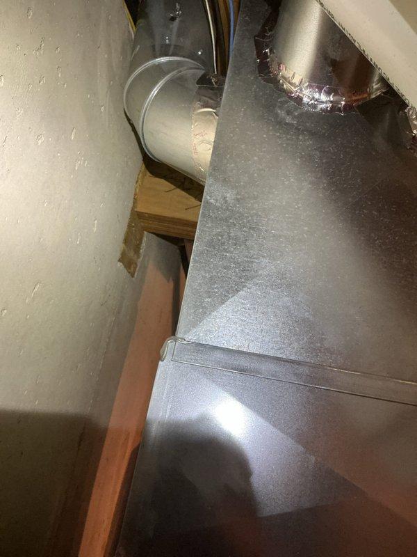 Responded to service call for persistent rattling noise from 2014 Goodman furnace that continued despite previous service attempts. Upon arrival, conducted thorough inspection of furnace and ductwork system while unit was operating normally. Identified source of rattling noise coming from supply plenum and main trunk ductwork connections. Inspected all accessible ductwork joints, seams, and metal banding in basement installation area. Tightened loose sheet metal connections and secured ductwork supports where vibration was occurring. Verified all mechanical fasteners and drive clips were properly seated. Cycled furnace through multiple heating cycles to confirm noise elimination. Unit operating within normal parameters with no abnormal sounds detected upon completion.