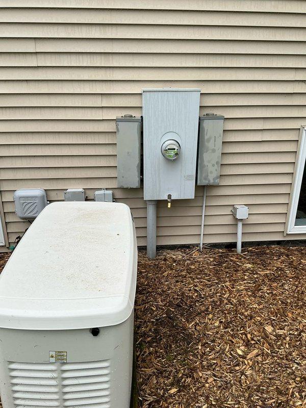 Conducted site assessment for standby generator upgrade at residential property. Current two-year-old generator unit is operational but customer requires larger capacity system to meet increased power demands. Evaluated existing installation including concrete pad, electrical connections, meter socket, and associated panels to determine compatibility with upgraded unit. Documented current setup and discussed potential relocation of existing generator to alternate residence. Photographed existing generator placement, electrical infrastructure, conduit routing, and available installation space for sizing and proposal preparation.