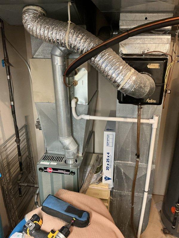 Completed annual cooling maintenance on 11-year-old Goodman AC system. Performed comprehensive tune-up including inspection of evaporator coil, refrigerant lines, and ductwork connections. Verified proper operation of furnace and air handler unit, checked all electrical connections, and ensured system components were secure and functioning within manufacturer specifications. System operating efficiently with no issues found.